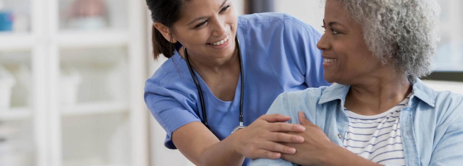 Nurse smiling at a patient