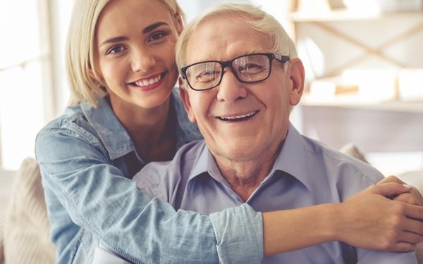 Woman and older man smiling