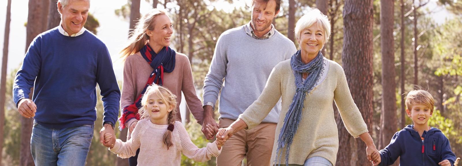 Family walking through a forest