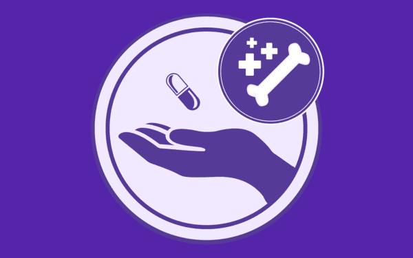 Hand outreached with pill in palm