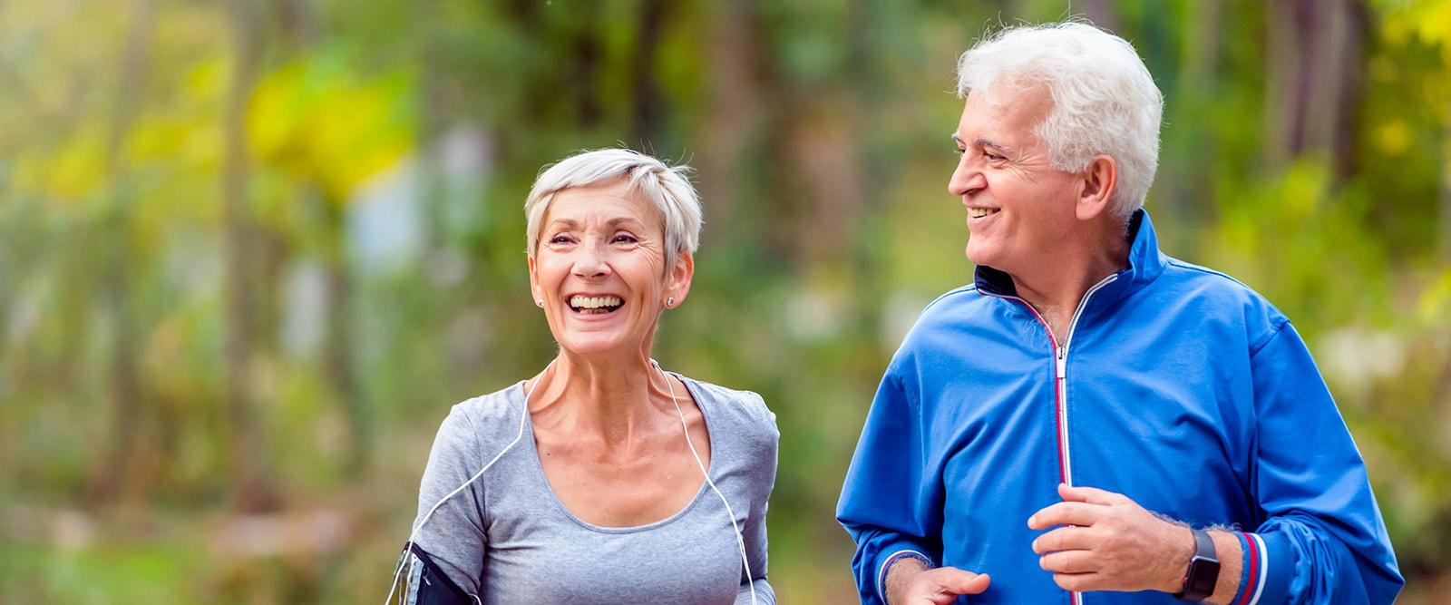 Older man and woman running