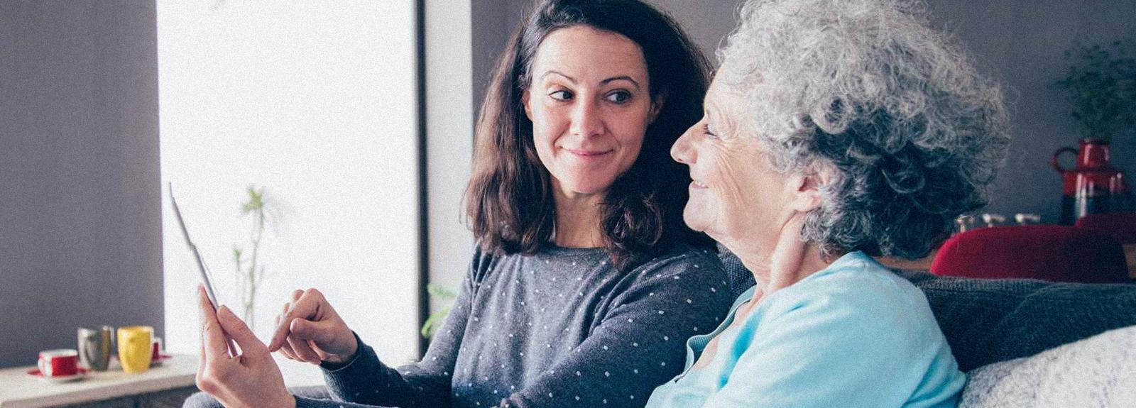 Two women looking at a tablet