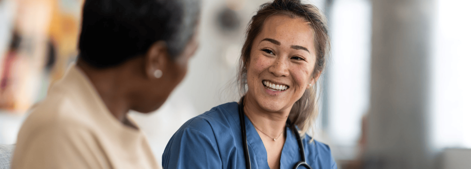 Medical professional smiling at a patient
