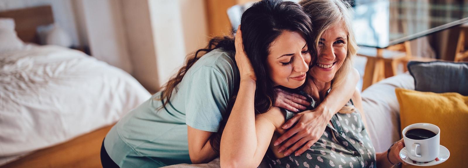 Two woman hugging